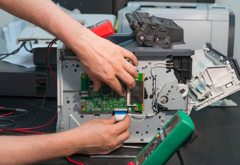 man fixing harddrive